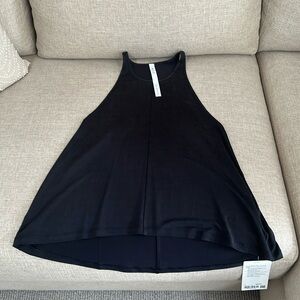 Lululemon suede like feel fabric. Swing style never worn. Size 4